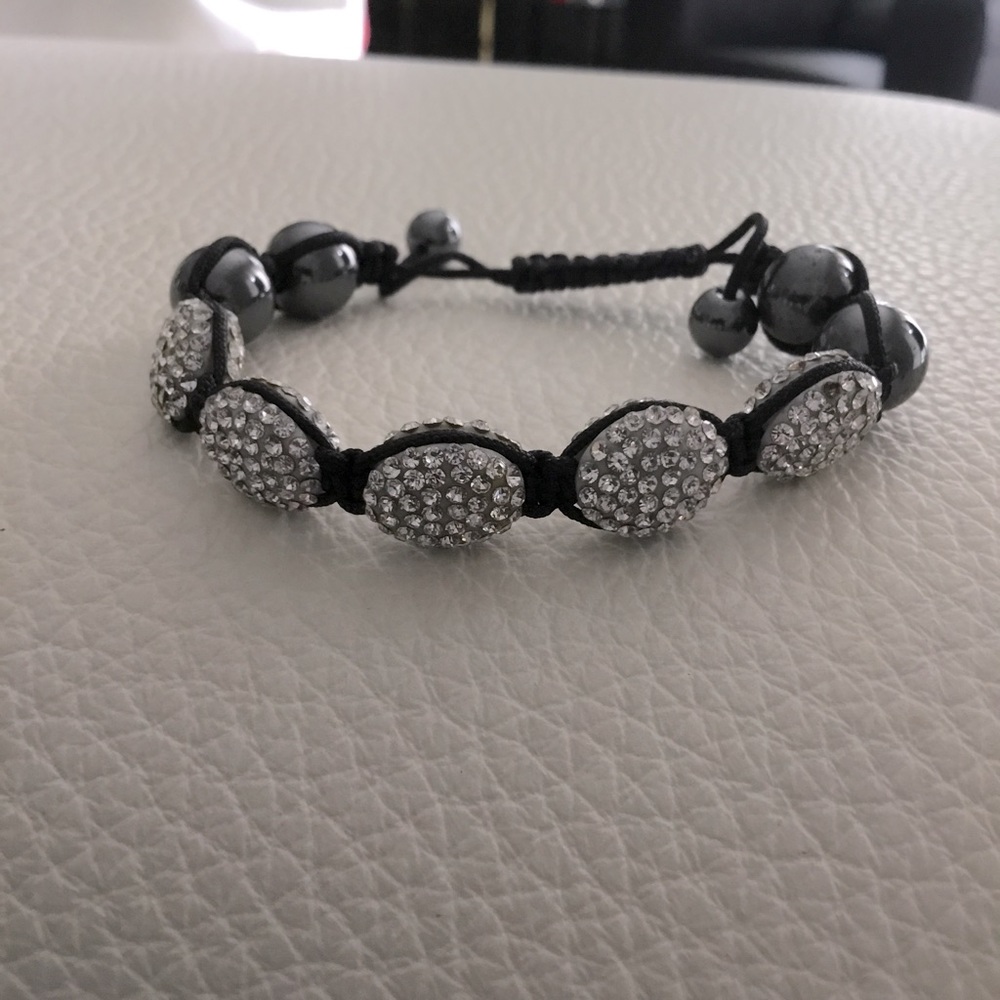 Bling bracelet with black tone Pave Crystal. Cord string adjustment EUC